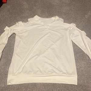 Born Primitive cream colored top. Size medium.